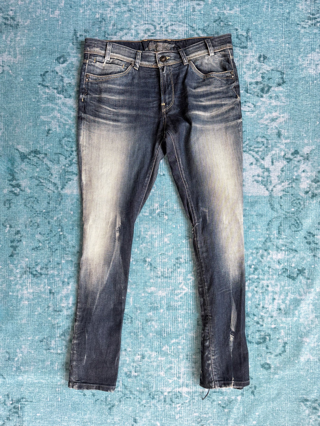 laced-back jeans