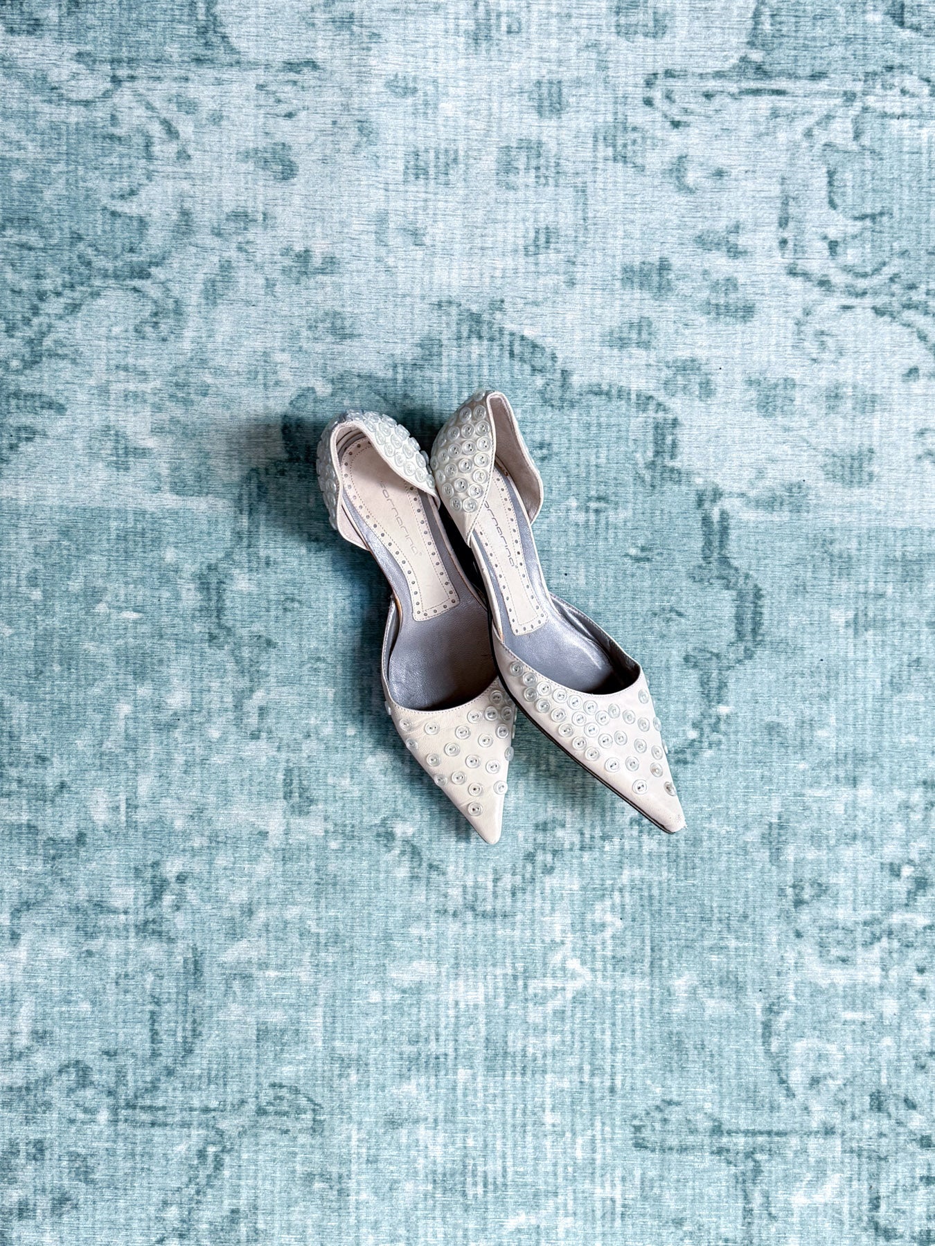 button-embossed kitten heels