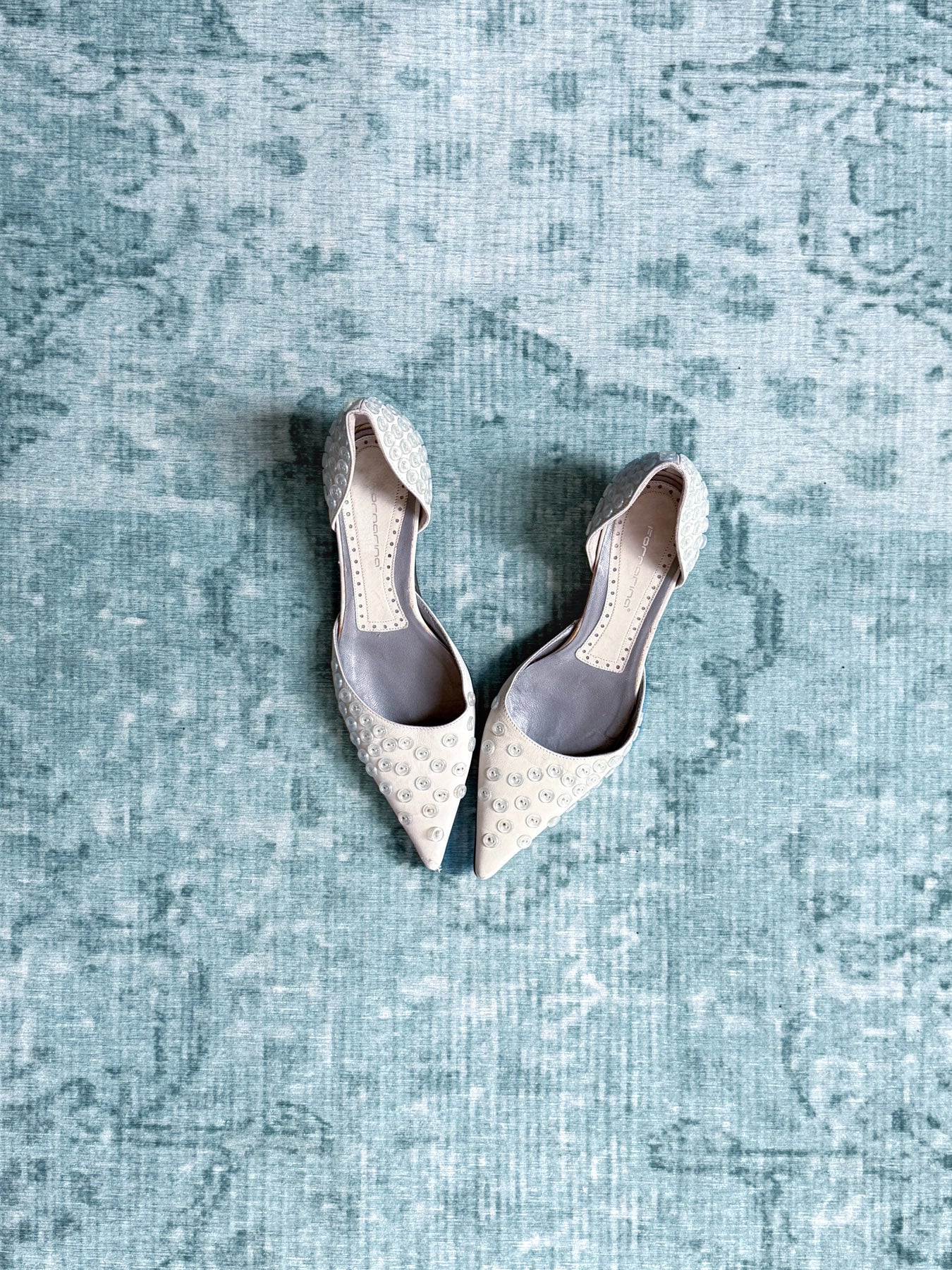 button-embossed kitten heels