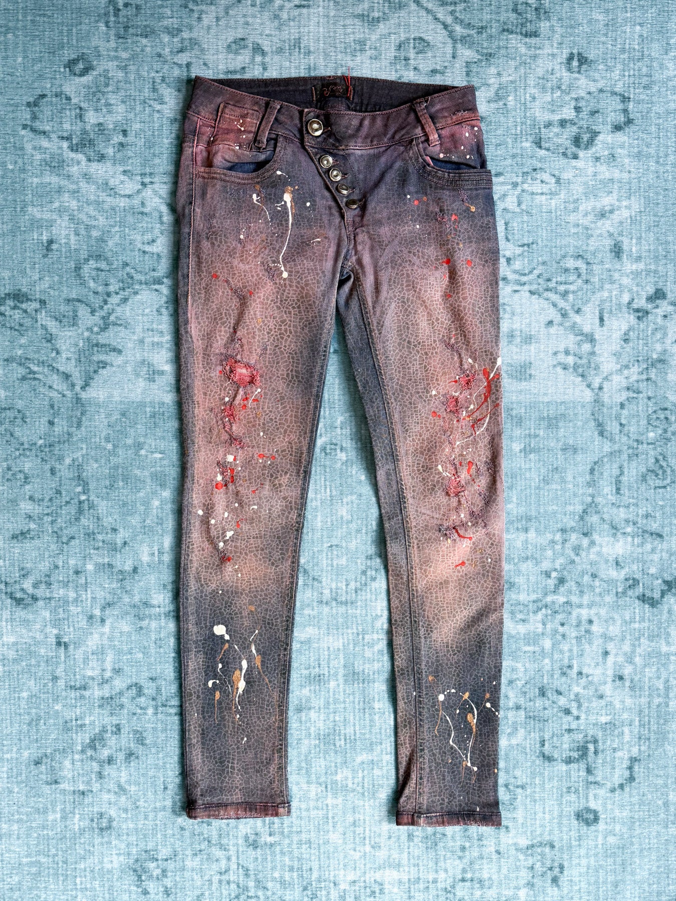 crackle print paint splatter skinny jeans