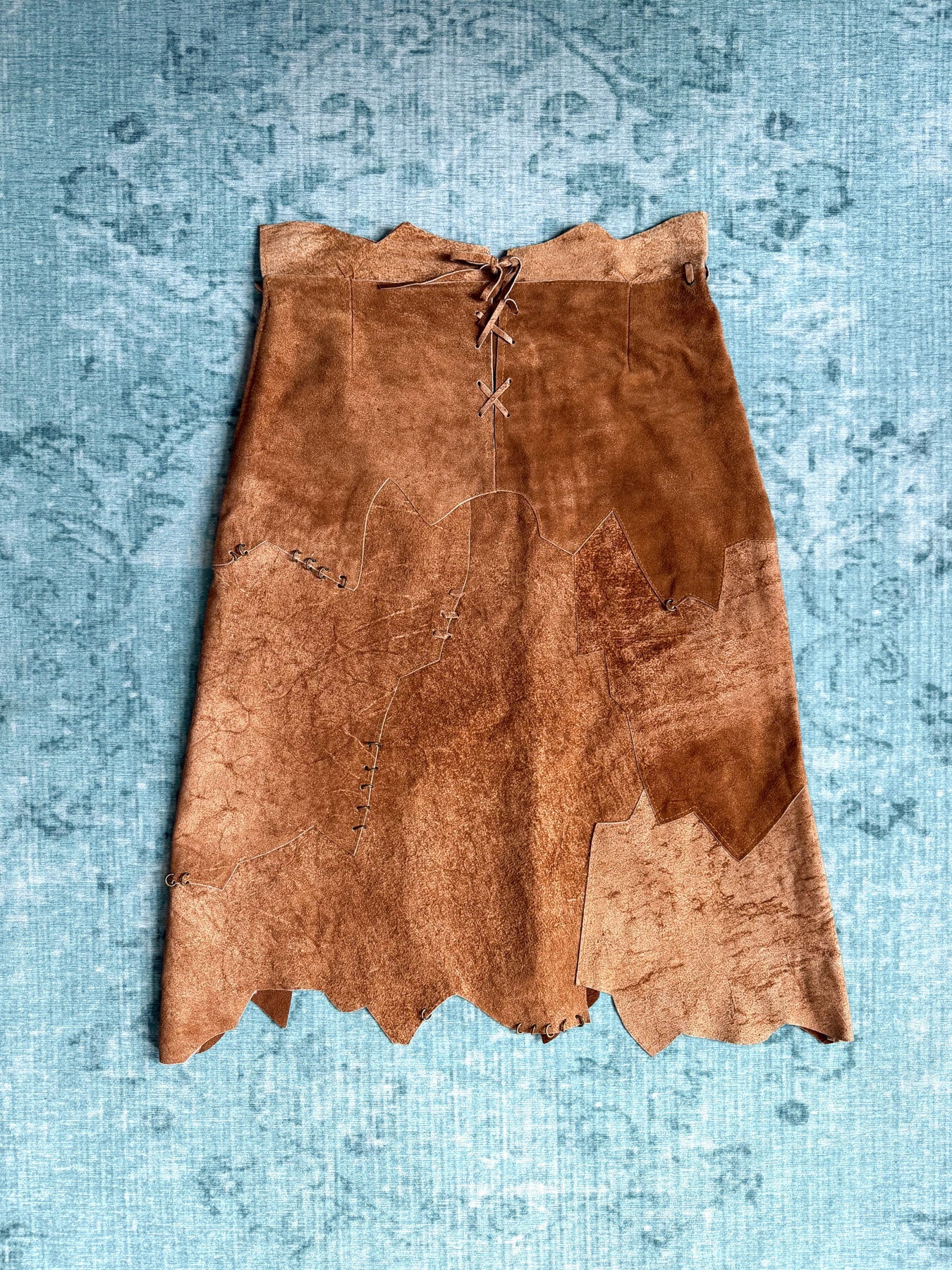 patchwork suede pierced raw-edge skirt