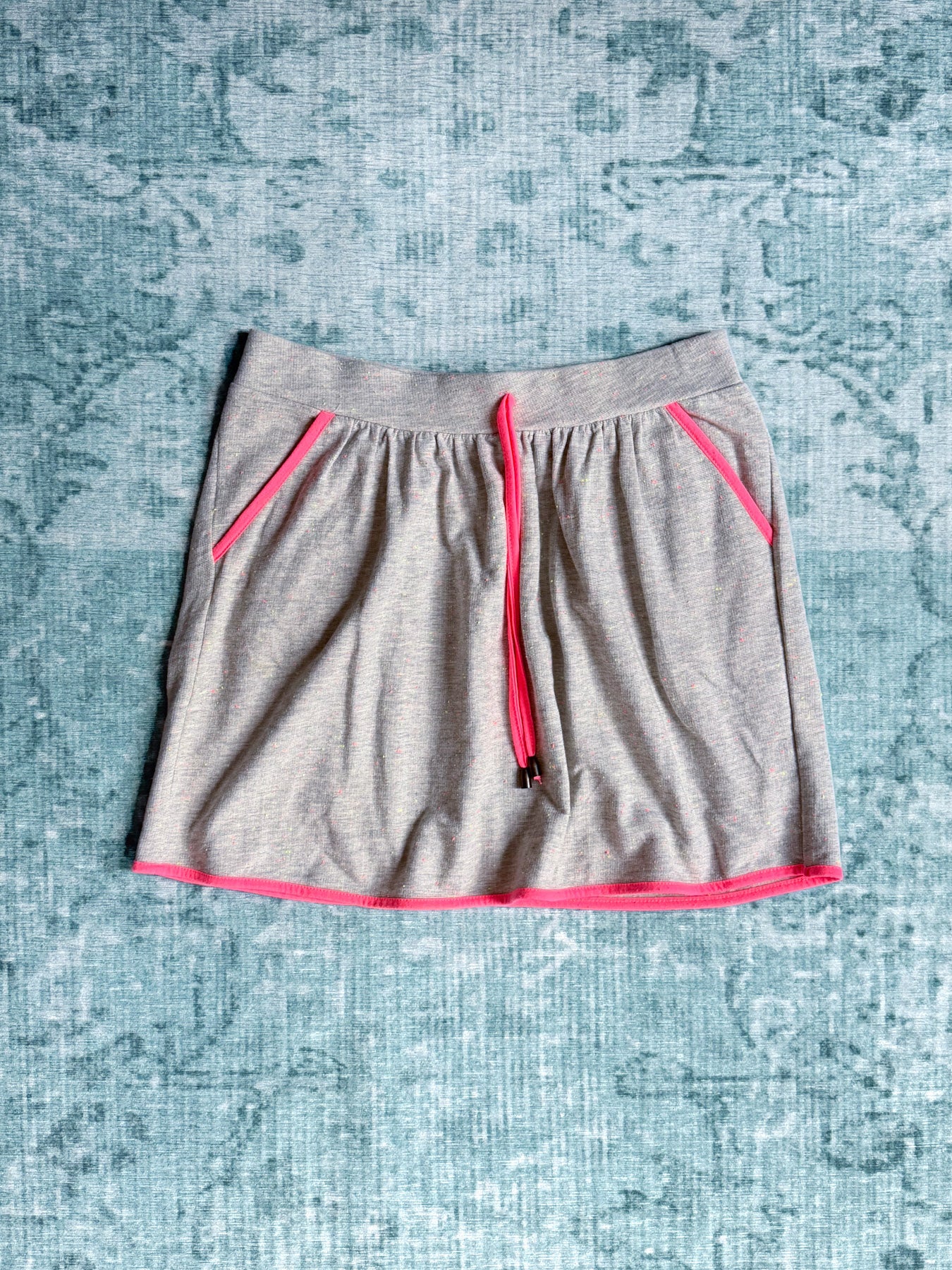 grey jersey skirt with neon pink trim